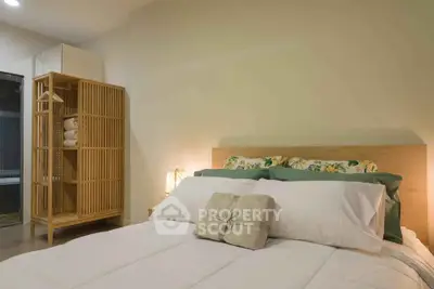 Cozy bedroom with modern wooden storage and plush bedding