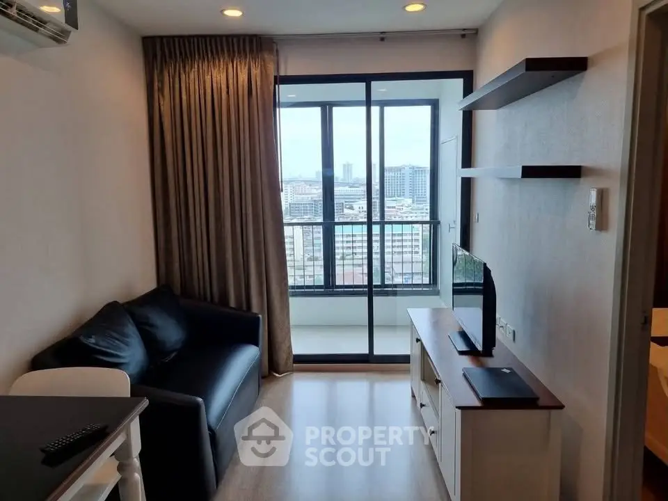 Modern living room with balcony view in high-rise apartment