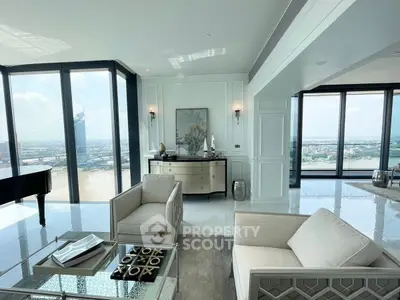 Luxurious high-rise living room with panoramic city views and elegant decor.