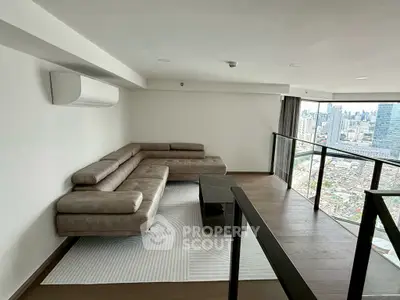Modern living room with panoramic city view and stylish L-shaped sofa