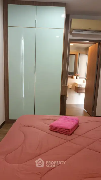 Cozy bedroom with modern wardrobe and ensuite bathroom