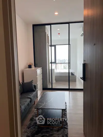 Modern apartment interior with sleek design and city view from the window.