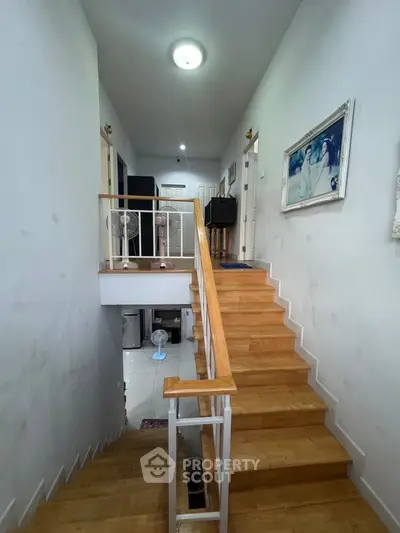 Spacious two-story home with wooden staircase and modern decor