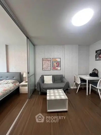 Modern studio apartment with cozy living area and stylish decor