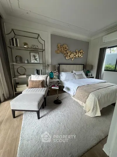 Luxurious bedroom with elegant decor and cozy ambiance, featuring stylish furniture and modern design elements.