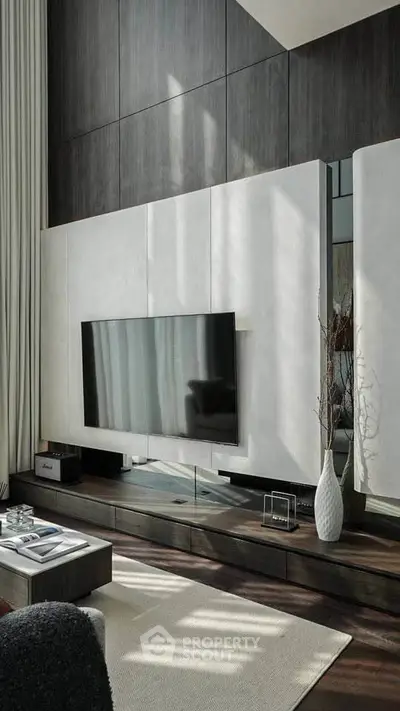 Luxurious modern living room with sleek TV setup and elegant decor