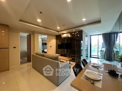 Spacious modern living room with open dining area and large windows