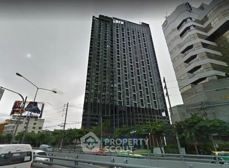 Modern high-rise building with sleek design in urban setting