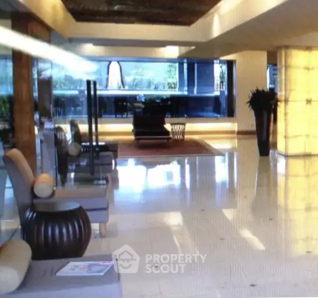 Luxurious building lobby with elegant seating and modern decor