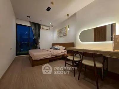 Modern bedroom with stylish decor and large window offering city view