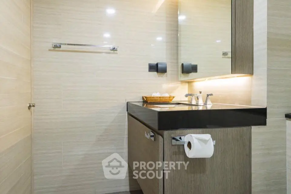 Modern bathroom with sleek vanity and ambient lighting