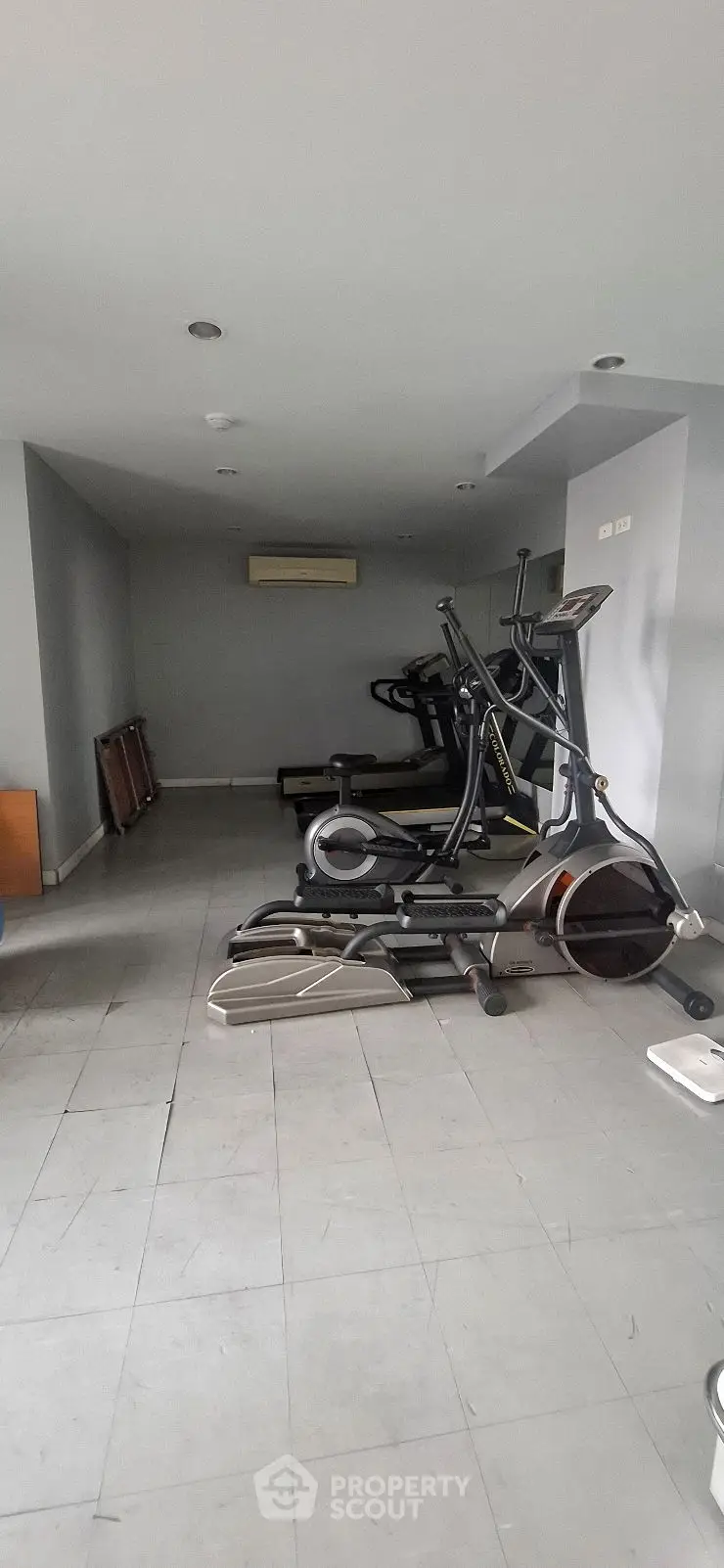 Modern gym with sleek exercise equipment and minimalist design