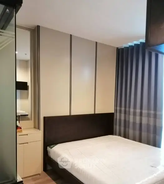 Modern bedroom with sleek design and ample natural light
