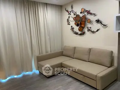 Modern living room with stylish sectional sofa and artistic wall decor