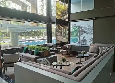 Luxurious modern living room with pool view in high-rise building