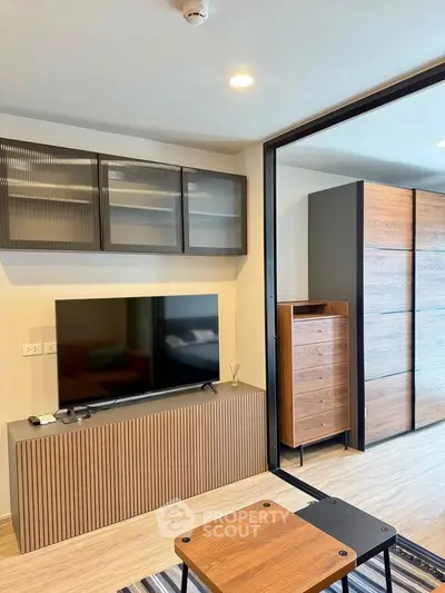 Modern living room with sleek TV stand and stylish wooden furniture