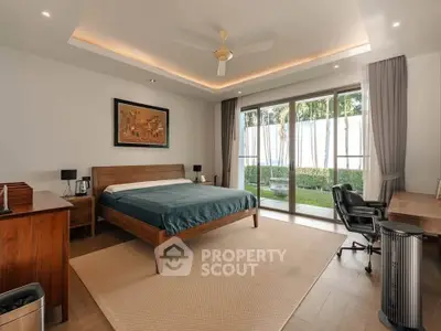 Spacious bedroom with garden view and modern furnishings