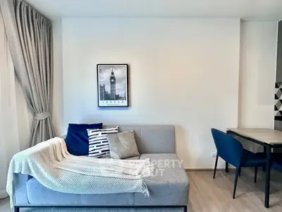 Modern living room with stylish decor and cozy seating area.