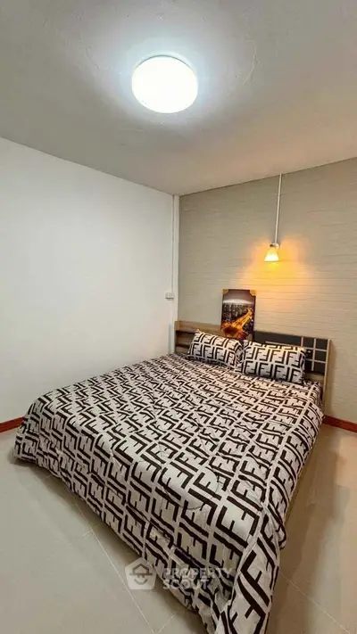 Cozy bedroom with stylish bedding and warm lighting