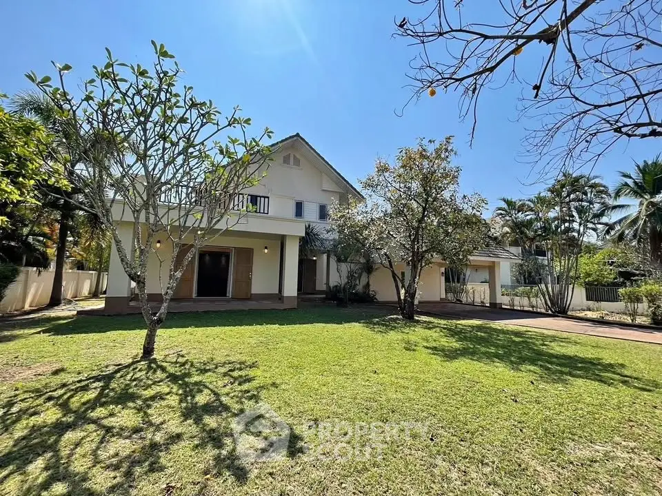 Charming two-story home with lush garden and spacious front yard