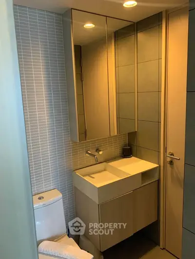 Modern bathroom with sleek design and compact vanity unit