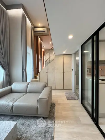 Modern duplex living room with elegant staircase and stylish decor