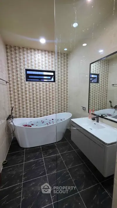 Luxurious bathroom with modern bathtub and elegant tile design
