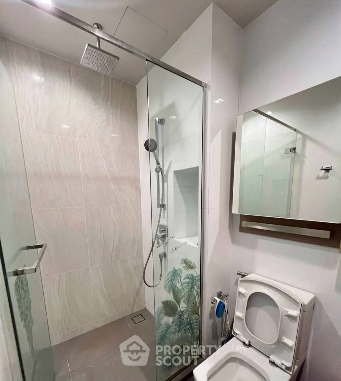 Modern bathroom with glass shower and sleek fixtures