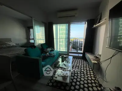 Cozy living room with balcony view in modern apartment