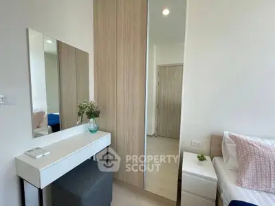 Modern bedroom with stylish decor and natural light