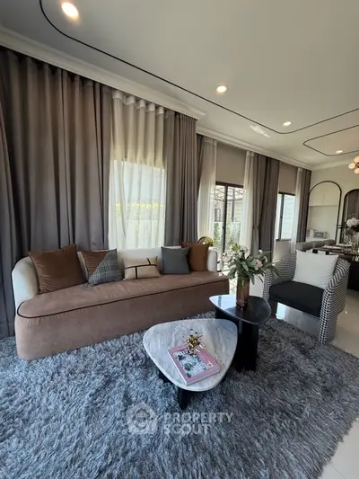 Luxurious living room with elegant decor and plush furnishings, perfect for modern living.