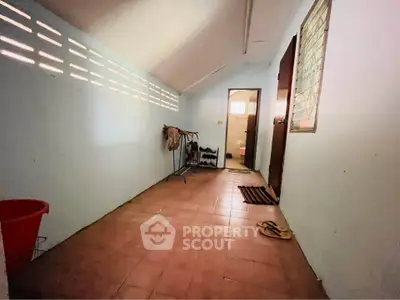 Spacious storage room with tiled floor and natural light