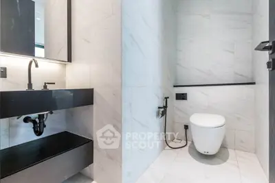 Modern bathroom with sleek fixtures and elegant marble tiles