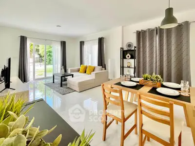 Spacious modern living room with dining area and large windows