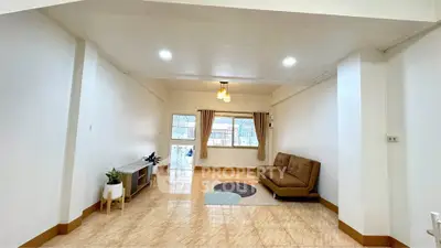 Spacious living room with modern decor and natural light