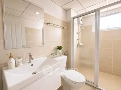 Modern bathroom with sleek fixtures and spacious shower in a contemporary home.