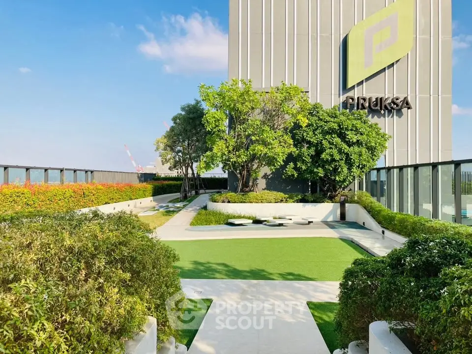 Stunning rooftop garden with lush greenery and modern design in a high-rise building.