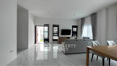 Spacious modern living room with sleek design and natural light