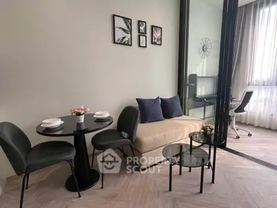 Modern living room with stylish decor and glass partition to study area