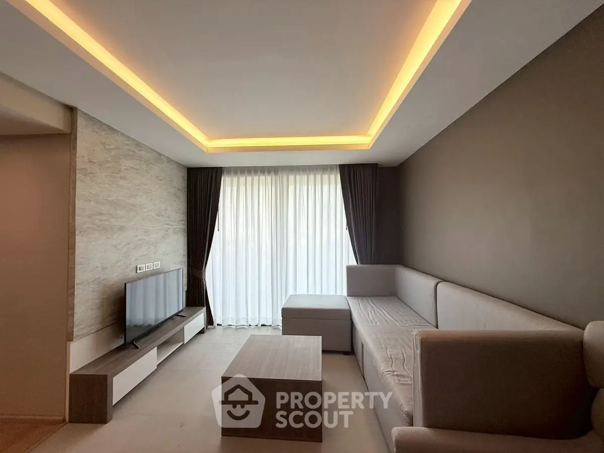 Modern living room with elegant lighting and sleek furniture design