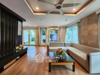 Spacious modern living room with large windows and garden view