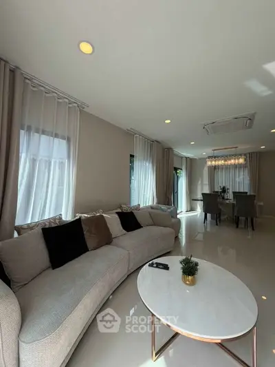 Elegant living room with modern furniture and natural light
