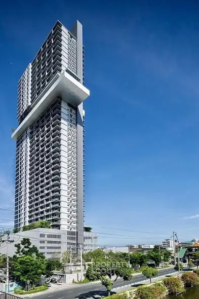 Stunning modern high-rise building with unique architectural design and panoramic city views.