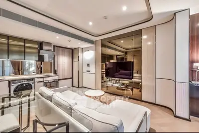 Luxurious modern living room with sleek design and integrated kitchen appliances.