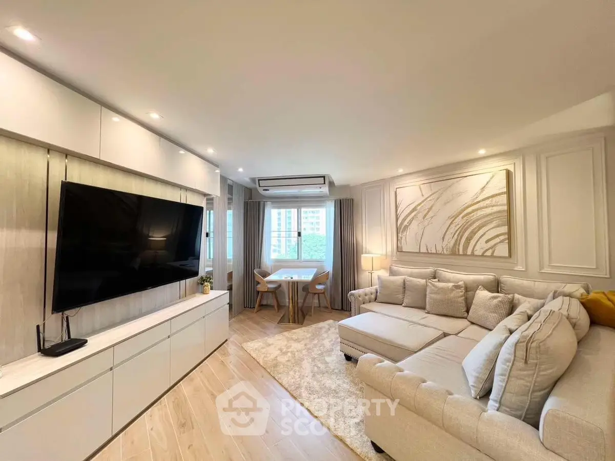 Spacious modern living room with large TV and elegant decor