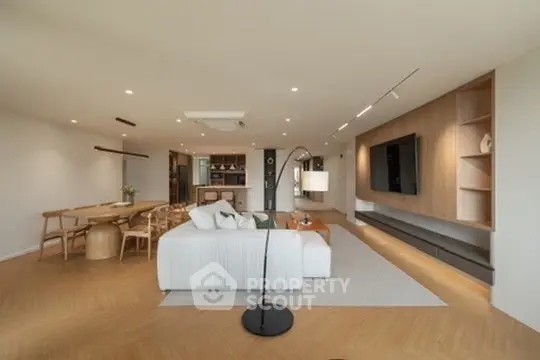 Spacious modern living room with elegant decor and open layout, perfect for entertaining.