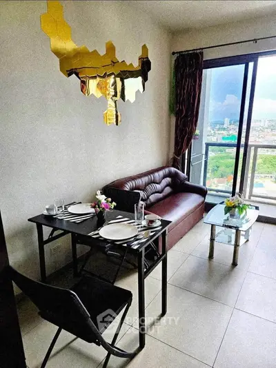 Chic living room with modern decor and stunning city view from balcony.