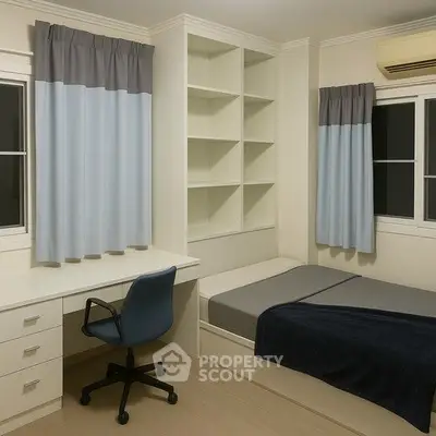 Modern minimalist bedroom with built-in shelves and study desk