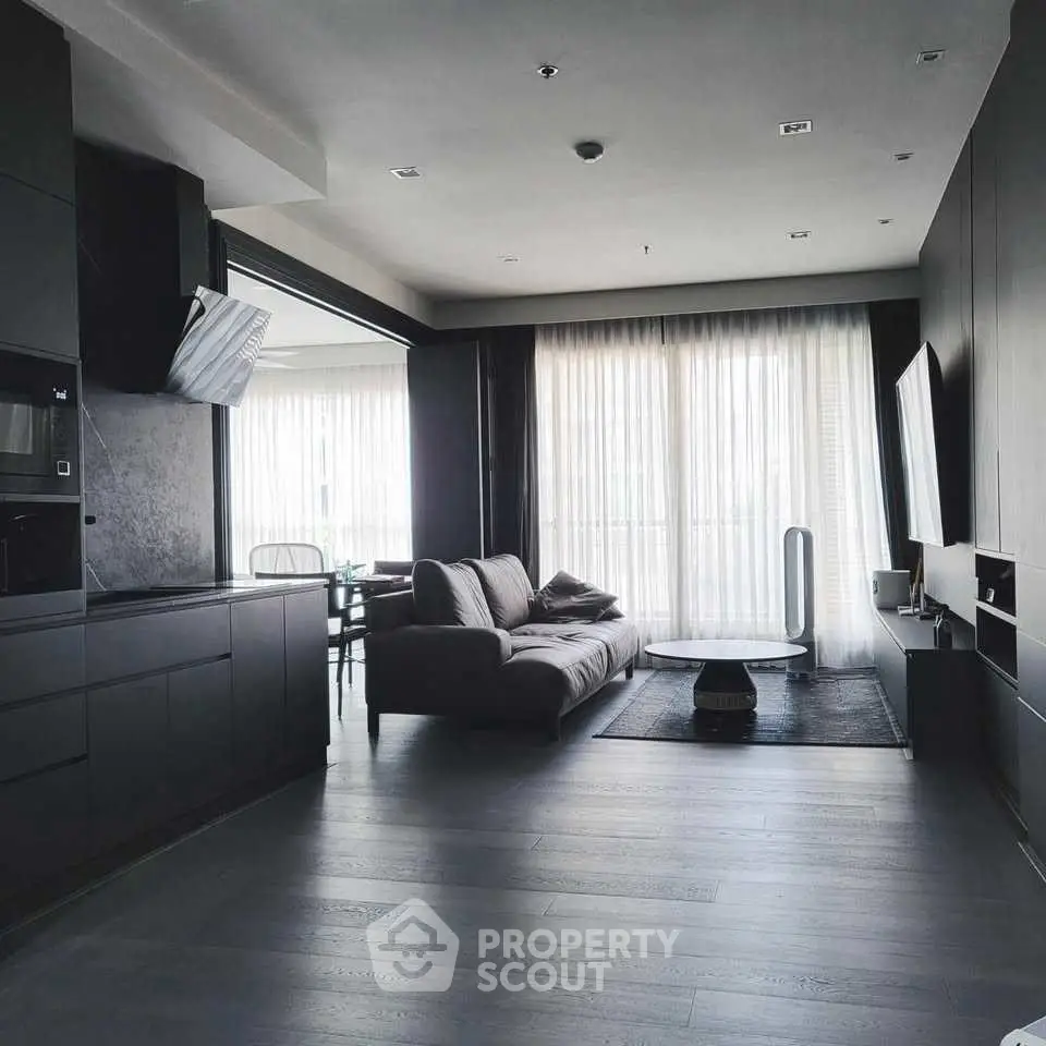 Modern living room with sleek design and large windows for natural light