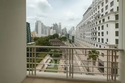 Stunning cityscape view from a modern apartment balcony overlooking lush greenery and urban skyline.